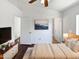 Bright main bedroom featuring modern decor, a large window and two doorways at 1805 E Bluefield Ave, Phoenix, AZ 85022