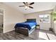 Bedroom featuring a ceiling fan, window, and dark wood furniture at 1936 S Mariposa Rd, Apache Junction, AZ 85119