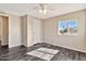 Bright bedroom with luxury vinyl plank flooring, a closet, and a scenic view from the window at 1936 S Mariposa Rd, Apache Junction, AZ 85119