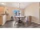 Dining room featuring a round table, 4 chairs, grey floors, and a chandelier at 1936 S Mariposa Rd, Apache Junction, AZ 85119