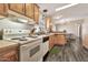 Traditional kitchen with white appliances and wood-look flooring at 1936 S Mariposa Rd, Apache Junction, AZ 85119