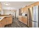 Bright kitchen featuring stainless steel appliances and wood-look flooring at 1936 S Mariposa Rd, Apache Junction, AZ 85119