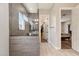 Bright bathroom featuring tiled walk-in shower with glass and a neutral color palette at 2081 E Aquarius Pl, Chandler, AZ 85249