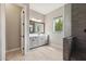 Modern bathroom featuring a sleek vanity, refined fixtures, and a glass-enclosed shower at 2081 E Aquarius Pl, Chandler, AZ 85249