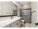 Bathroom featuring a vanity with an undermount sink, a toilet, and a tiled shower at 2081 E Aquarius Pl, Chandler, AZ 85249