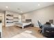 Bright bedroom showcasing hardwood floors, open shelving, and ample natural light at 2081 E Aquarius Pl, Chandler, AZ 85249