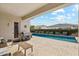 Covered patio with seating area, a grill, and a view of the refreshing in-ground pool at 2081 E Aquarius Pl, Chandler, AZ 85249