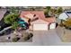 Aerial view of home showcasing well-maintained landscaping, a private patio, and three car garage at 21500 N 262Nd Ln, Buckeye, AZ 85396