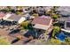 Aerial view of home with patio and awning, fenced backyard and pool at 21500 N 262Nd Ln, Buckeye, AZ 85396