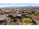 Aerial view of home with patio, awning, fenced yard, desert landscaping, and view of mountains in the distance at 21500 N 262Nd Ln, Buckeye, AZ 85396