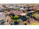 Aerial view of home showing patio with awning, desert landscaping, and fenced yard with artificial turf at 21500 N 262Nd Ln, Buckeye, AZ 85396