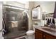 Bathroom featuring a glass enclosed shower and modern sink with neutral decor at 21500 N 262Nd Ln, Buckeye, AZ 85396