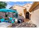 Inviting front porch with outdoor seating area, perfect for relaxing and enjoying the desert view at 21500 N 262Nd Ln, Buckeye, AZ 85396