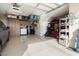 Spacious garage featuring ample storage, epoxy flooring and overhead storage racks at 21500 N 262Nd Ln, Buckeye, AZ 85396