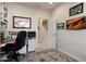 Functional office space with a desk, storage, and a view to an open doorway at 21500 N 262Nd Ln, Buckeye, AZ 85396