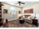 Cozy sitting room featuring a large window with natural light and decorative rug at 21500 N 262Nd Ln, Buckeye, AZ 85396