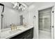 Bright bathroom with a dual sink vanity and modern fixtures at 22317 N 39Th Run, Phoenix, AZ 85050