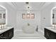 Luxurious bathroom with a stand-alone tub and dual vanity sinks at 22317 N 39Th Run, Phoenix, AZ 85050