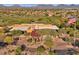 Extravagent clubhouse featuring an American flag, desert landscaping, and golf course views at 22317 N 39Th Run, Phoenix, AZ 85050