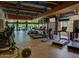 Well-equipped gym featuring cardio machines, exposed beams, and views of the Arizona landscape at 22317 N 39Th Run, Phoenix, AZ 85050