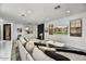 Bright living room with sleek fireplace, modern furnishings, and neutral color palette at 22317 N 39Th Run, Phoenix, AZ 85050