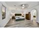 Spacious main bedroom featuring an archway to the ensuite and neutral color palette at 22317 N 39Th Run, Phoenix, AZ 85050