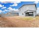 Large backyard with dirt, featuring a covered patio and block wall fencing along the perimeter at 22679 E Estrella Rd, Queen Creek, AZ 85142