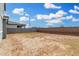 Expansive backyard with dirt and block wall fencing, perfect for outdoor activities and landscaping at 22679 E Estrella Rd, Queen Creek, AZ 85142