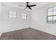 Neutral bedroom with ceiling fan and multiple windows at 22679 E Estrella Rd, Queen Creek, AZ 85142