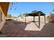 Paver patio, gazebo, shed and gravel area in this large backyard at 2305 S Orange --, Mesa, AZ 85210