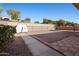 Spacious backyard featuring a large, gravel-covered area, a shed, and covered patio at 2305 S Orange --, Mesa, AZ 85210