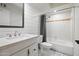 Bright bathroom with white vanity, ship lap wall, and updated shower at 2305 S Orange --, Mesa, AZ 85210