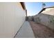 Exterior shot of the side yard featuring a walkway and gravel landscaping for low maintenance at 2305 S Orange --, Mesa, AZ 85210