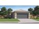 Charming one-story home featuring a gray garage door and a well-manicured front lawn at 25109 N 174Th Ln, Surprise, AZ 85387