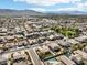 Community aerial view of many homes with desert landscaping and blue swimming pools at 2520 W Minton St, Phoenix, AZ 85041