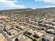 Community aerial view of many single-story homes with desert landscaping and a mountain view at 2520 W Minton St, Phoenix, AZ 85041