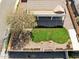 Aerial view of private backyard with healthy green lawn and desert landscaping, tile roof at 2520 W Minton St, Phoenix, AZ 85041