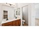 Bathroom featuring double sinks and a separate toilet room, providing functionality and privacy at 2520 W Minton St, Phoenix, AZ 85041