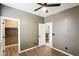 Bedroom with wood-look tile flooring and a closet with a shelf at 2520 W Minton St, Phoenix, AZ 85041