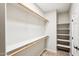 Bright closet featuring wooden shelving and ample storage, perfect for organization and accessibility at 2520 W Minton St, Phoenix, AZ 85041