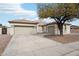 Charming single-story home featuring a well-manicured lawn and a spacious three-car garage at 2520 W Minton St, Phoenix, AZ 85041