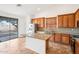 Kitchen with an island featuring stainless steel appliances and views of the backyard at 2520 W Minton St, Phoenix, AZ 85041