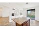 Kitchen island with granite countertop and stainless steel sink overlooking backyard at 2520 W Minton St, Phoenix, AZ 85041