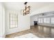 View of the open floorplan that features tile flooring, fireplace, and modern light fixture at 2520 W Minton St, Phoenix, AZ 85041