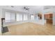 Well-lit living room with tile floors, a view into the kitchen, and modern recessed lighting at 2520 W Minton St, Phoenix, AZ 85041