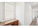 Bright office nook featuring a built-in desk, drawers, and natural light from a window at 2520 W Minton St, Phoenix, AZ 85041