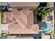 Aerial view of a home with a private pool, well manicured yard, and red tiled roof at 2738 W Silver Fox Way, Phoenix, AZ 85045