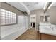 Bright bathroom with double sinks, separate shower and tub, tile flooring, and a window for natural light at 2738 W Silver Fox Way, Phoenix, AZ 85045