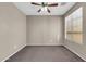 Comfortable bedroom with neutral walls, plush carpet, and a large window with natural light at 2738 W Silver Fox Way, Phoenix, AZ 85045