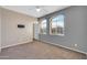 This bedroom features natural light from its large windows and a ceiling fan at 2738 W Silver Fox Way, Phoenix, AZ 85045